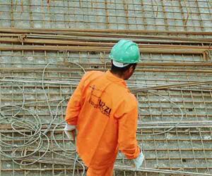 concrete worker in orange suit