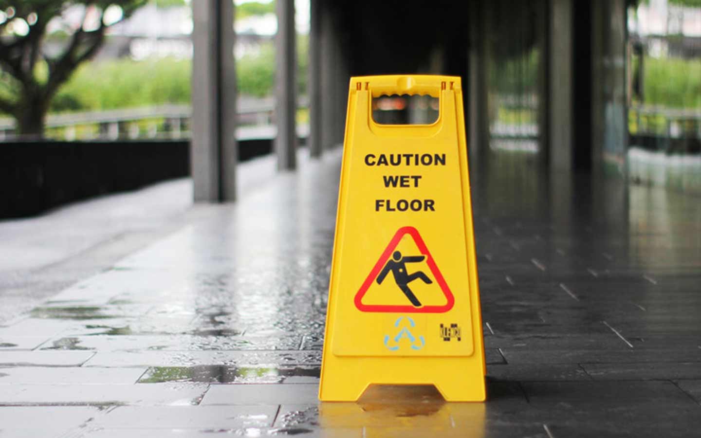 wet floor with caution sign
